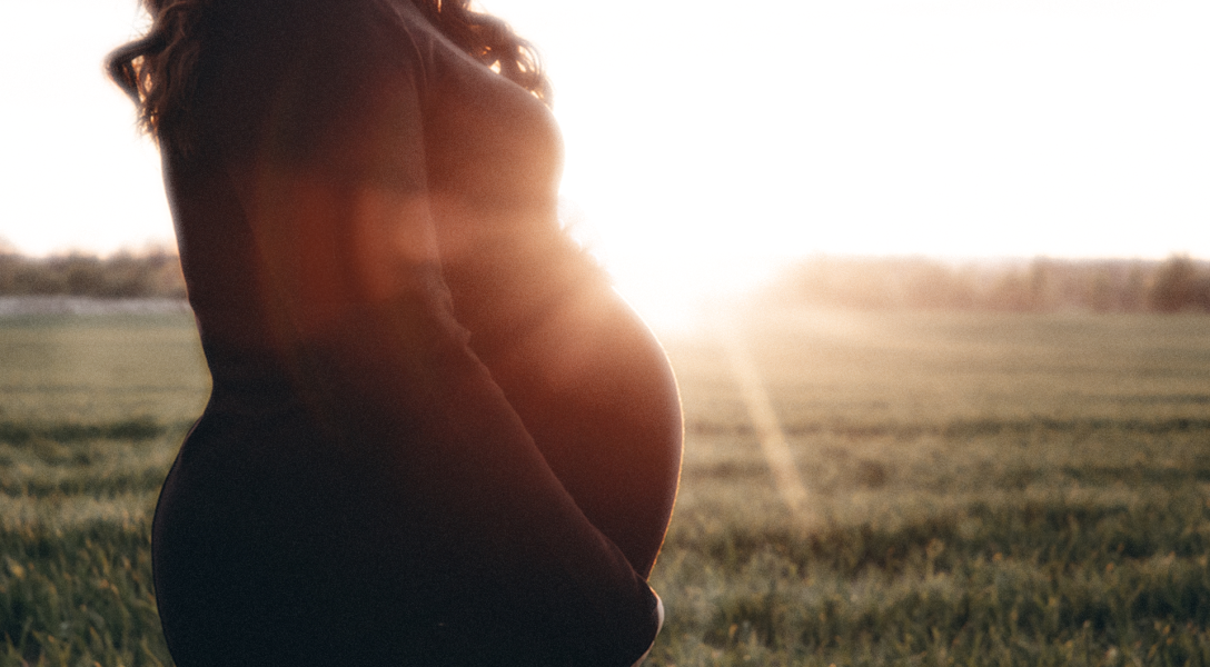 A color image showing the silhouette of a pregnant woman. Credit: Shutterstock