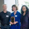 Cornell Bowers faculty recognized for excellence in teaching and research A color photo showing a man and two women posing for a photo. The woman in the middle is holding an award