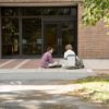 Two students in front of Comstock Hall